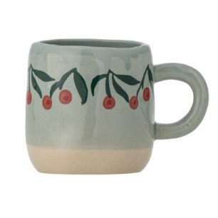 Tasse bleue avec cerise