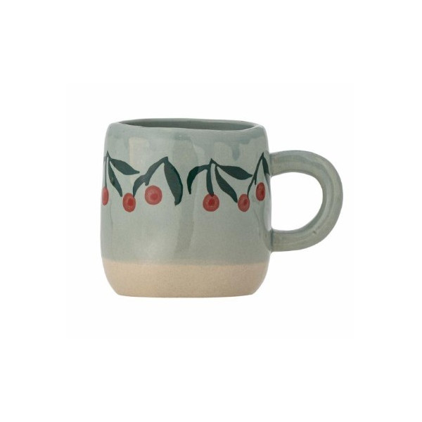 Tasse bleue avec cerise